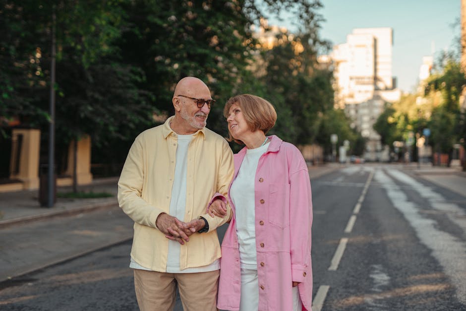 Elderly couple joyfully strolling on a quiet city street, showcasing love and togetherness.