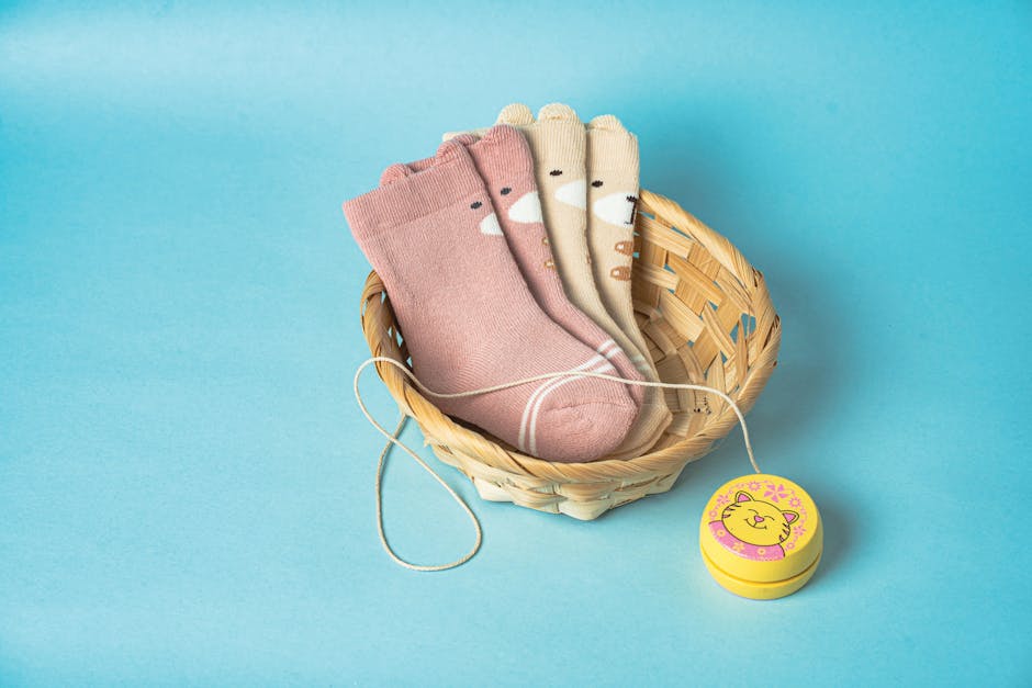 Charming cotton socks set in a basket with a playful toy, perfect for kids' fashion promotion.