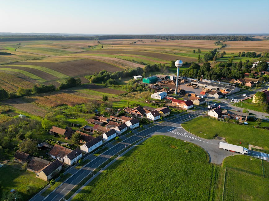 Aerial view of a rural village in Hercegovac, Croatia set in lush green landscapes.