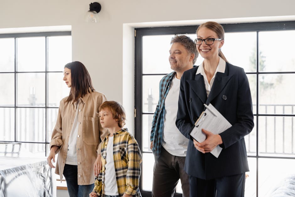 A family explores their new home with the help of a realtor, filled with excitement and anticipation.
