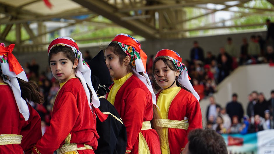 Children in traditional Turkish costumes perform at a festival in Istanbul, Türkiye.