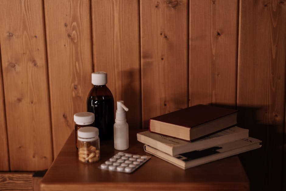 A cozy interior scene with medicines and books on a wooden bedside table, offering a warm and rustic ambiance.