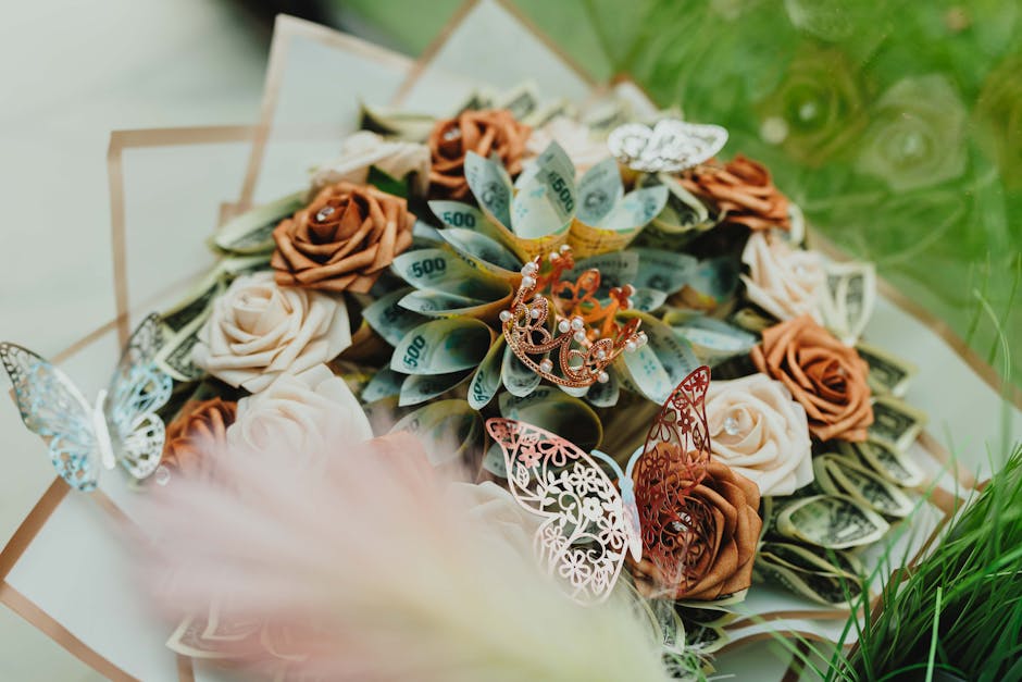 Artistic arrangement of roses and money in a bouquet, adorned with delicate butterflies.