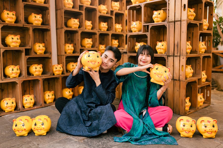 Young adults in traditional áo dài with piggy banks in Hội An, Vietnam.