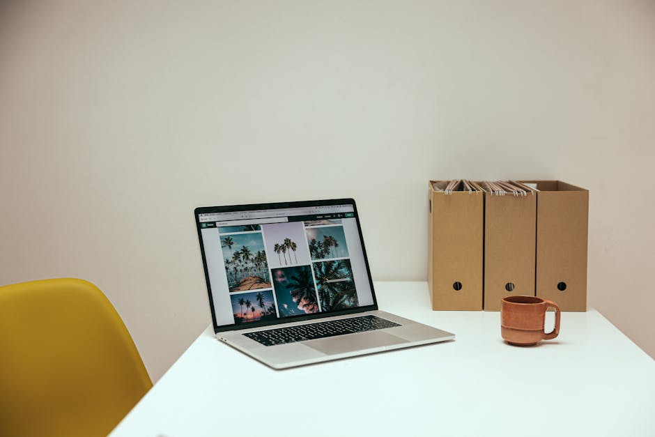 A cozy office desk setup with a laptop and coffee mug, perfect for productivity.