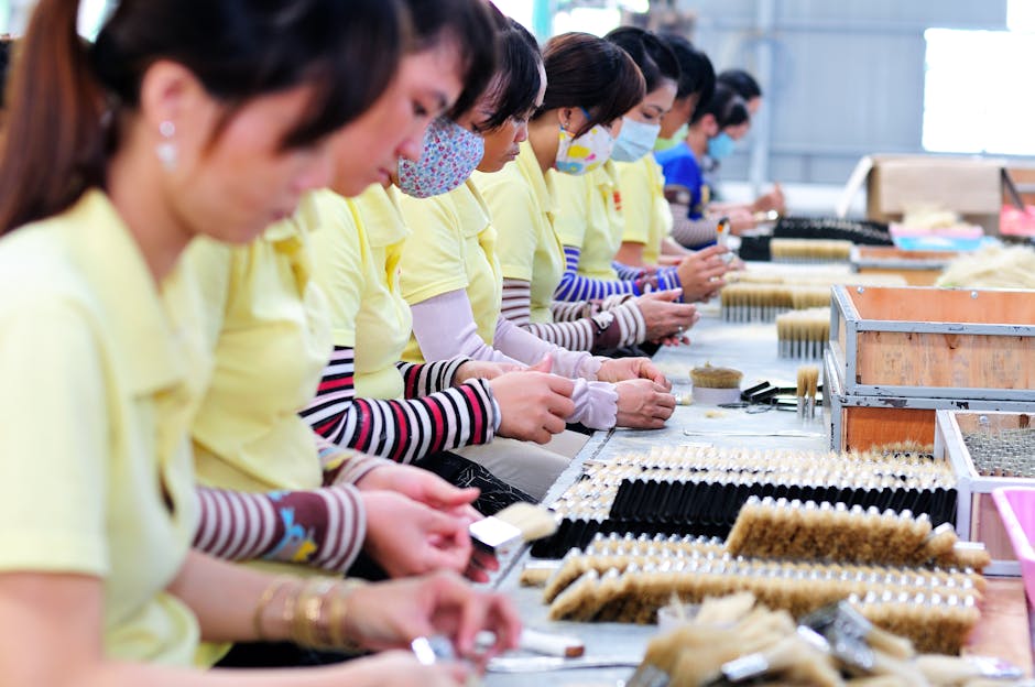 Women in a factory focusing on manufacturing with teamwork and precision.