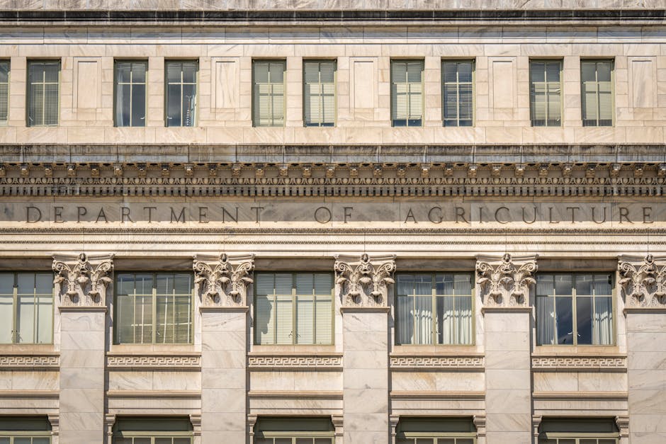 Close-up of the Department of Agriculture building's architectural facade, showcasing intricate columns and windows.