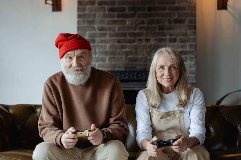 Happy elderly couple having fun playing video games together at home.