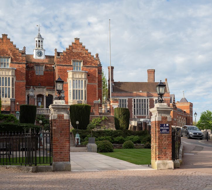 View of the grand entrance and architecture of Harrow School in London.