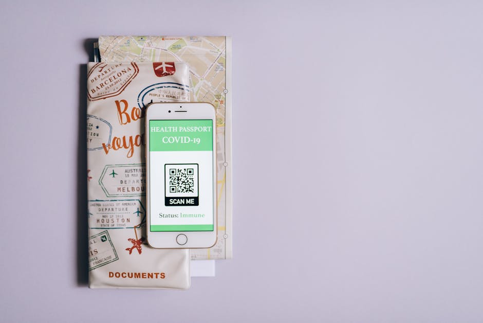 Smartphone displaying a COVID-19 health passport with travel documents on a purple background.