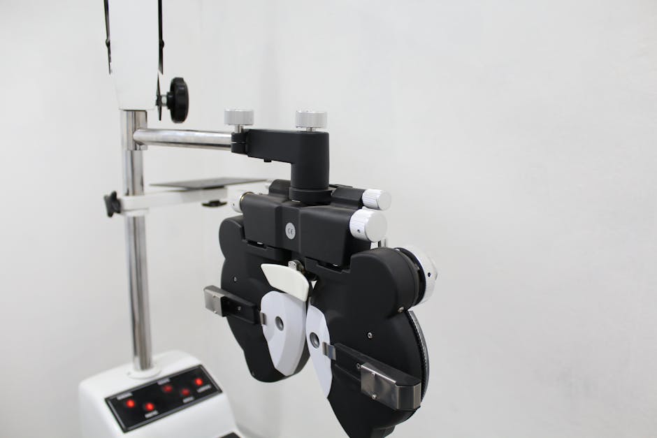 A phoropter used in optometry for eye examination in a bright medical office.