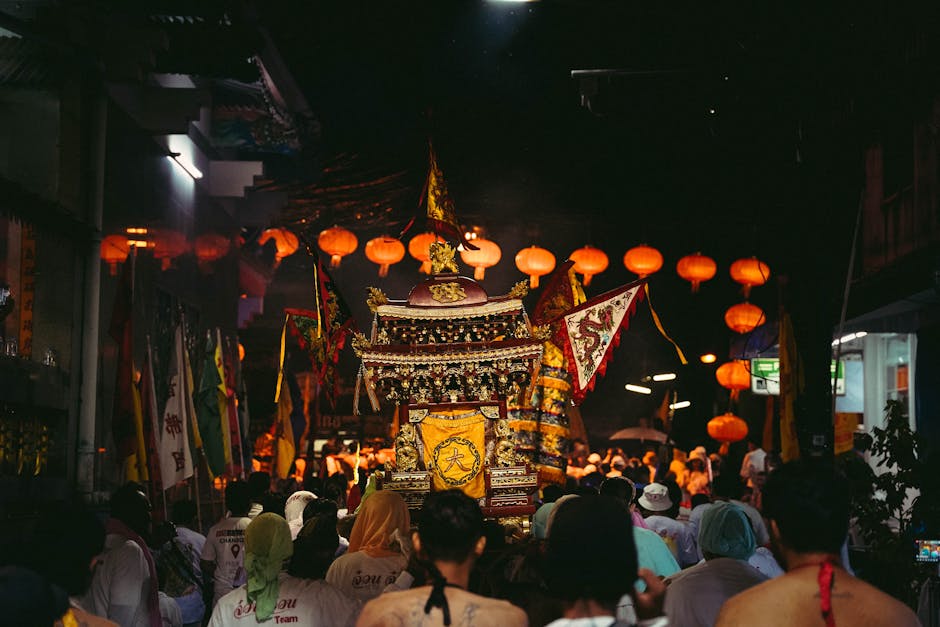 A colorful religious procession with lanterns and decorations in Phuket's streets, showcasing cultural traditions.