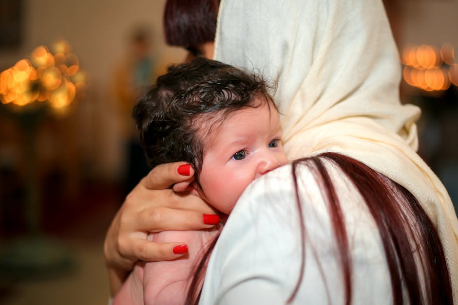 A tender moment of a mother holding her baby close, showcasing love and protection.