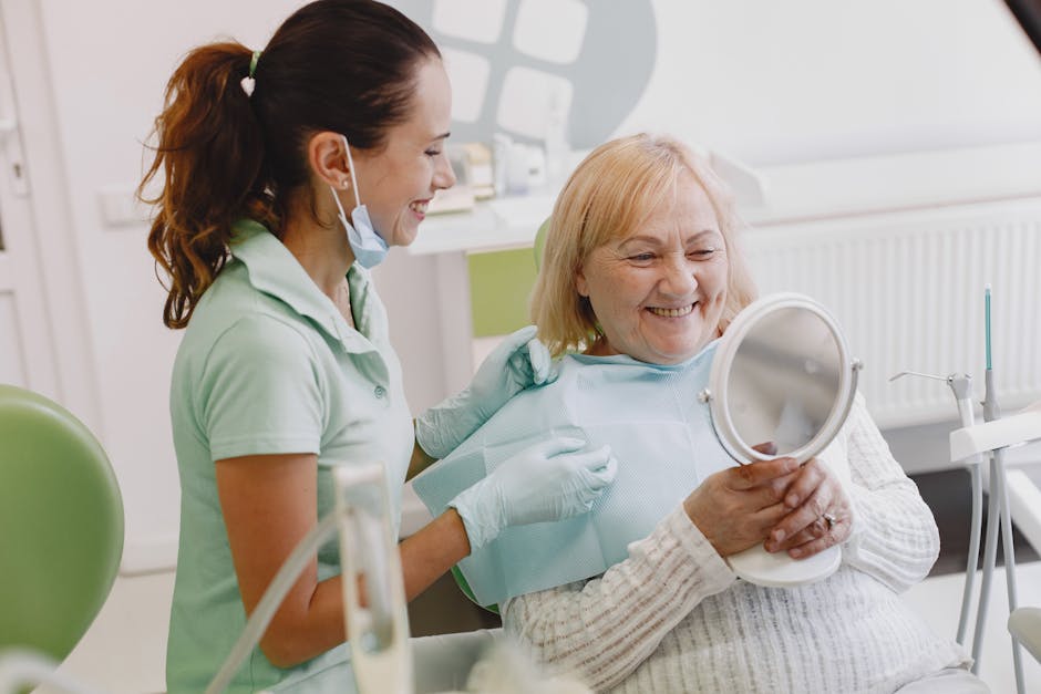 Senior patient at a dental check-up, smiling with the dentist in a modern clinic.