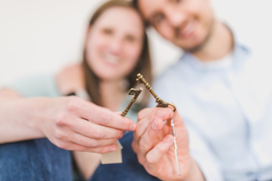 Smiling couple celebrates new home purchase, gripping vintage keys with love and excitement.