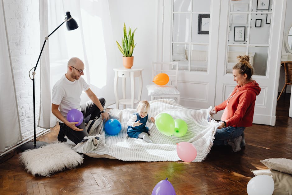 A joyful scene of a family with balloons enjoying quality time together indoors.