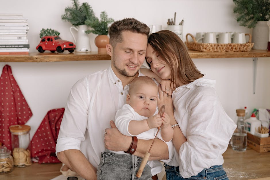 A joyful family of three embracing in a cozy kitchen. Warm and loving atmosphere.