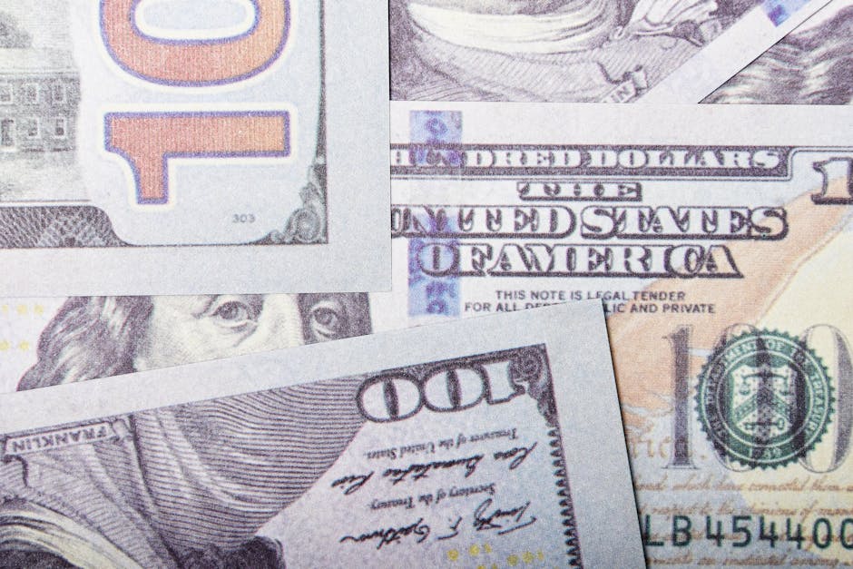Detailed close-up of US dollar banknotes showcasing currency design and textures.