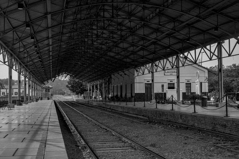 Monochrome view of Louveira train station showcasing its vintage architecture.