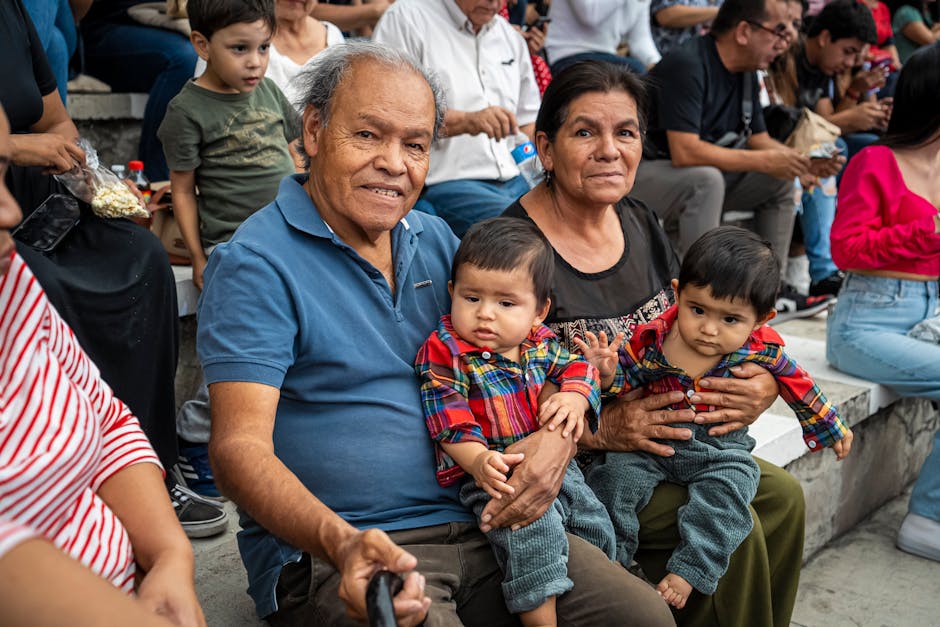 A joyful family moment captured with grandparents and grandchildren enjoying an outdoor gathering.