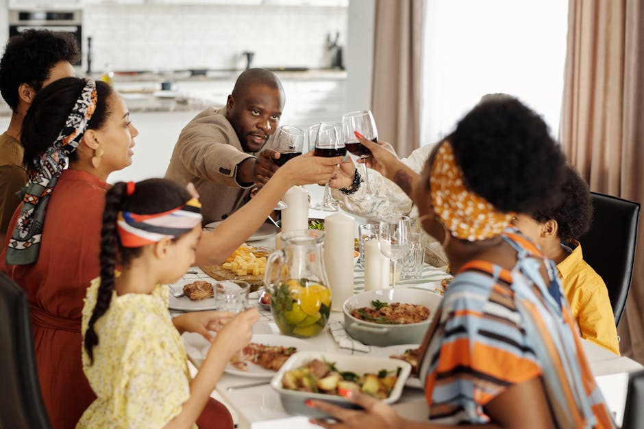 Family gathering in a cozy home, sharing a meal and raising glasses for a toast.