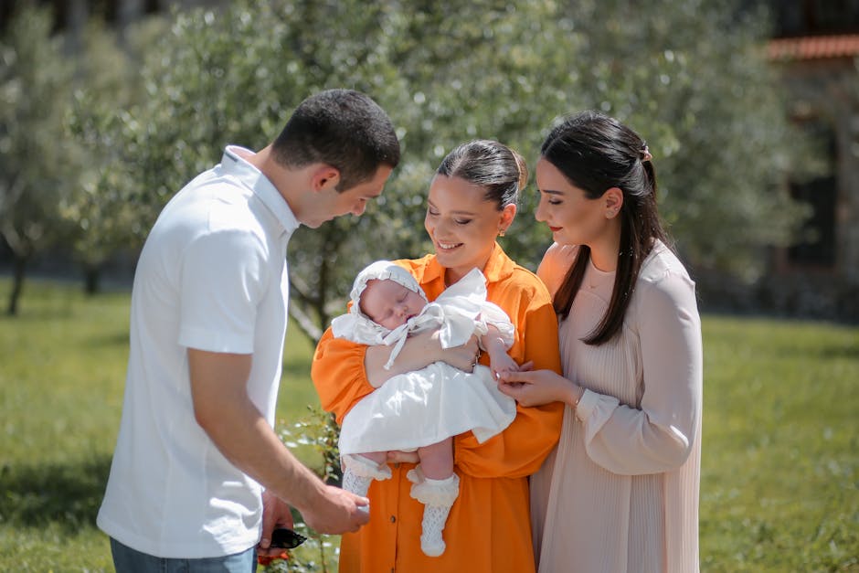 A joyful family moment with a newborn baby outdoors, capturing love and togetherness.