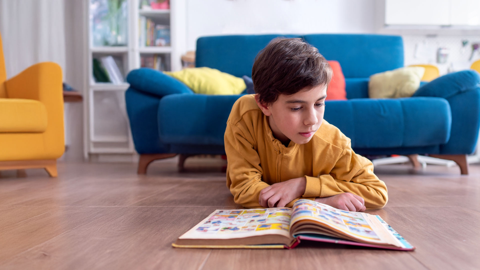 Child reading a Little Legends comic