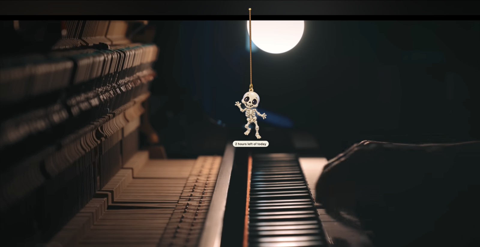 A skeleton charm swinging over a moonlit piano video, with a tag reading "2 hours left of today"
