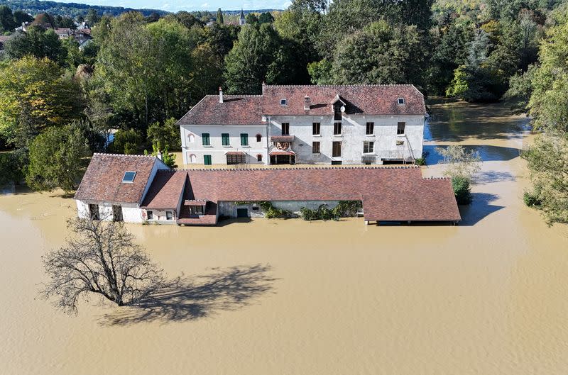 Country manor in flood waters.