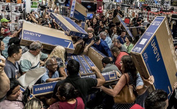 People in a store fight over TVs