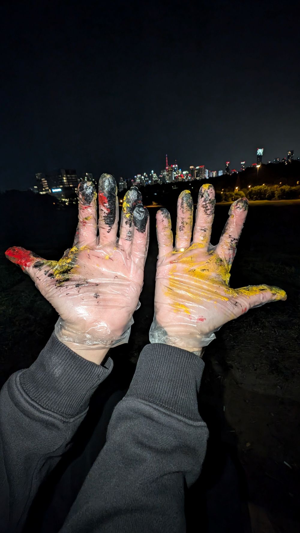 Louis's hands wearing gloves after a graffiti session