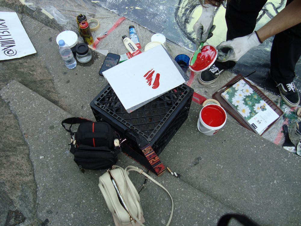 Louis painting on the street during the Yorkville Murals (YVM) Festival 2025