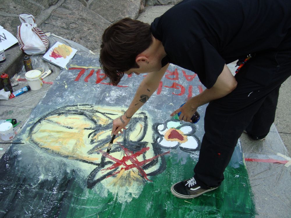 Louis painting on the street during the Yorkville Murals (YVM) Festival 2025
