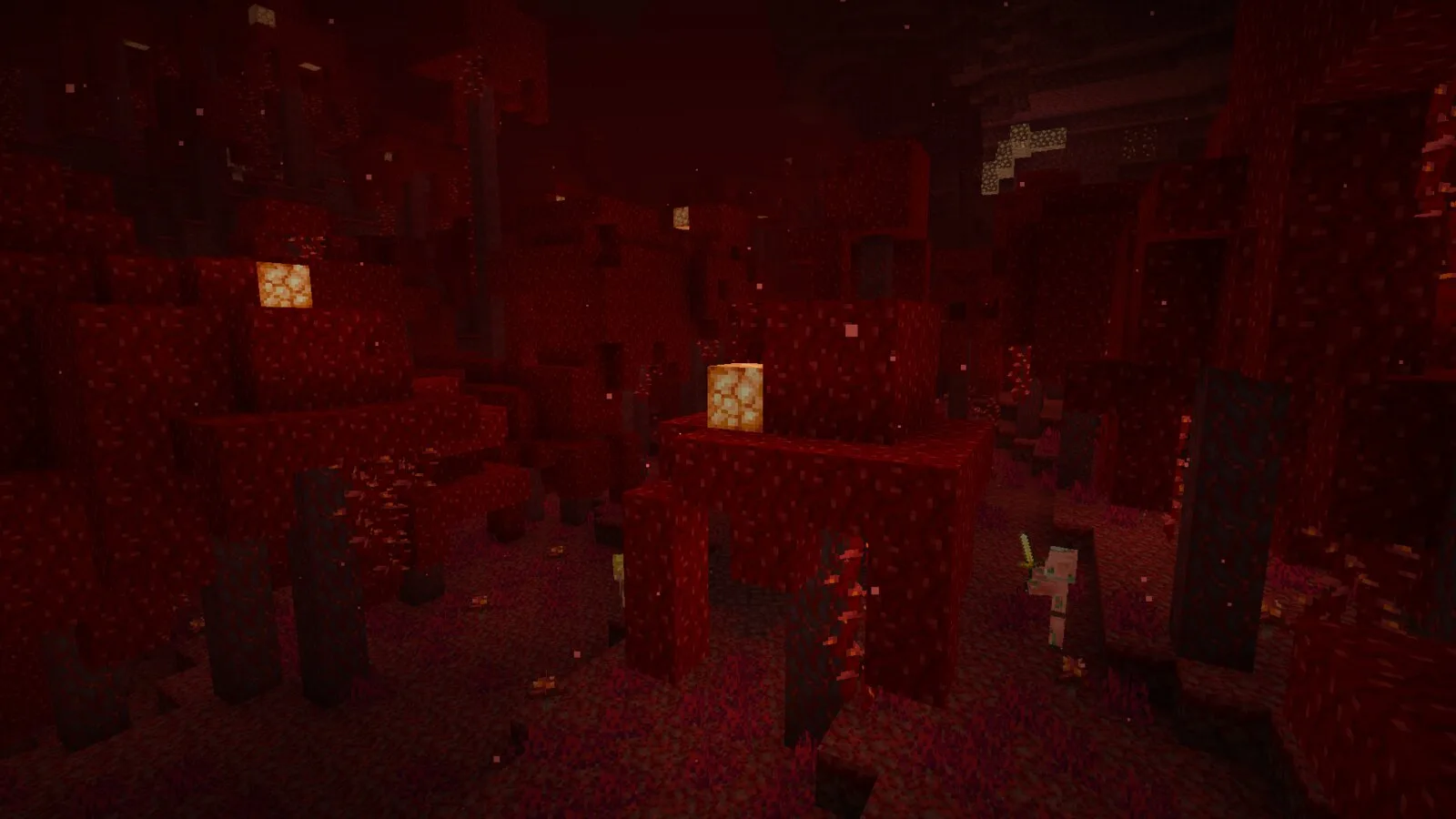 A crimson forest in the Nether with a zombified piglin