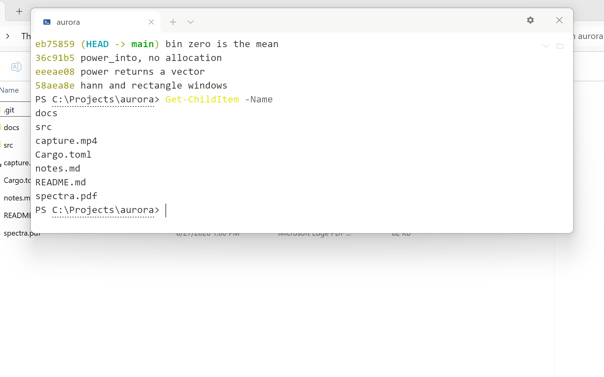 A terminal window hanging from the top of a screen, a little below the
       edge and centred, over a File Explorer window showing a small project's
       files. The terminal has one tab, a gear and a close button, and its shell
       has printed four commits and a directory listing above an empty prompt.