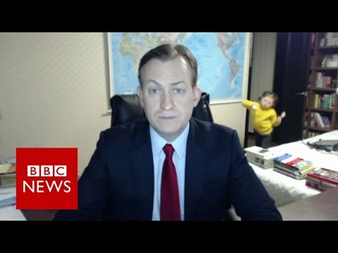 Image from BBC news of a child walking in to an office during an on-air interview