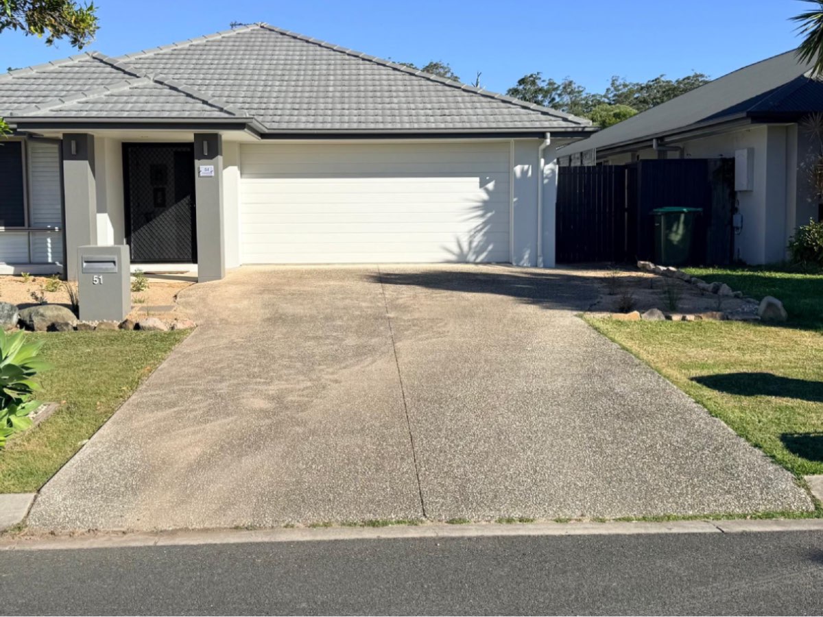 Driveway before pressure washing