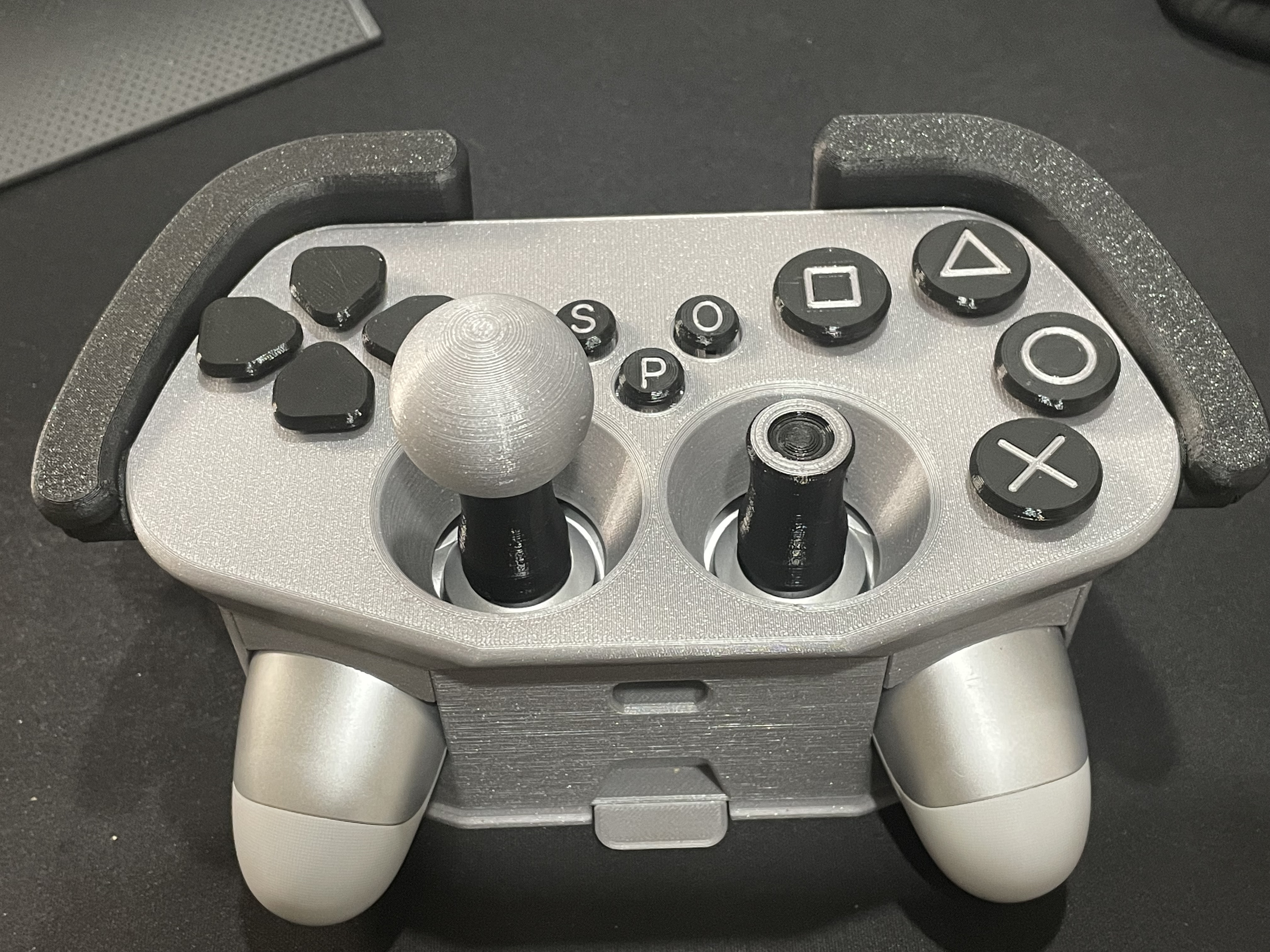 Picture of a black and gray Adaptive Case for PS4 Controller