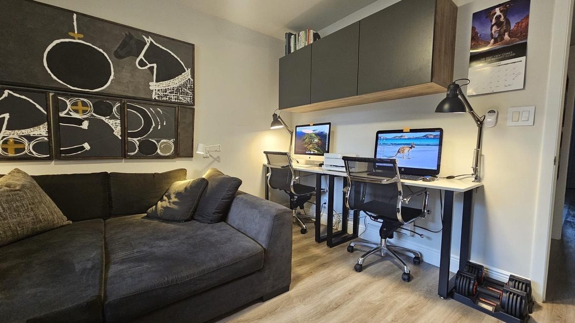 Den or study with desk and sofa