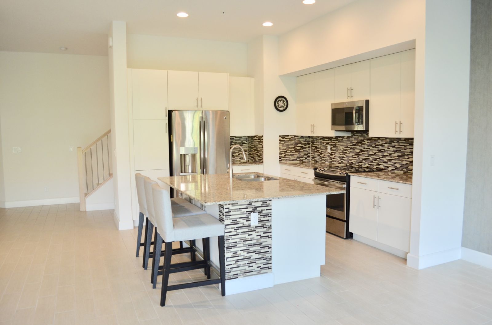 Kitchen with white cabinets and island