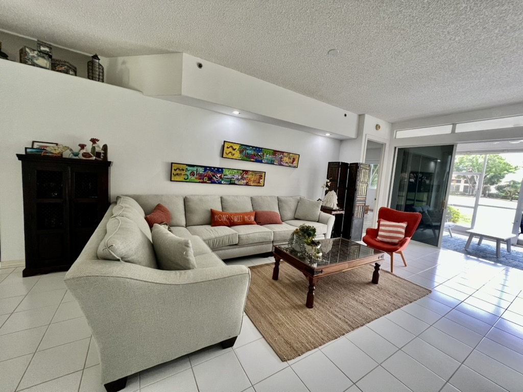 Living room with view to screened terrace