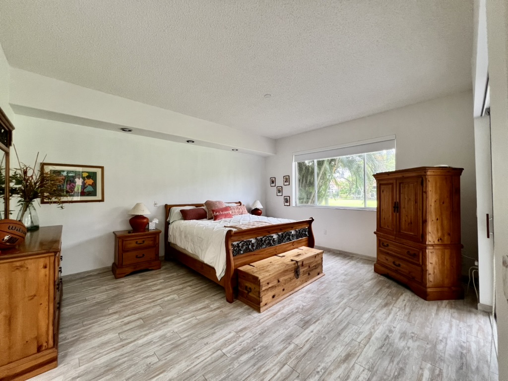 Primary bedroom with wood sleigh bed