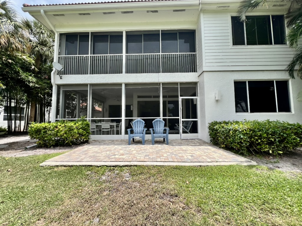 Exterior view of the screened terrace and lawn