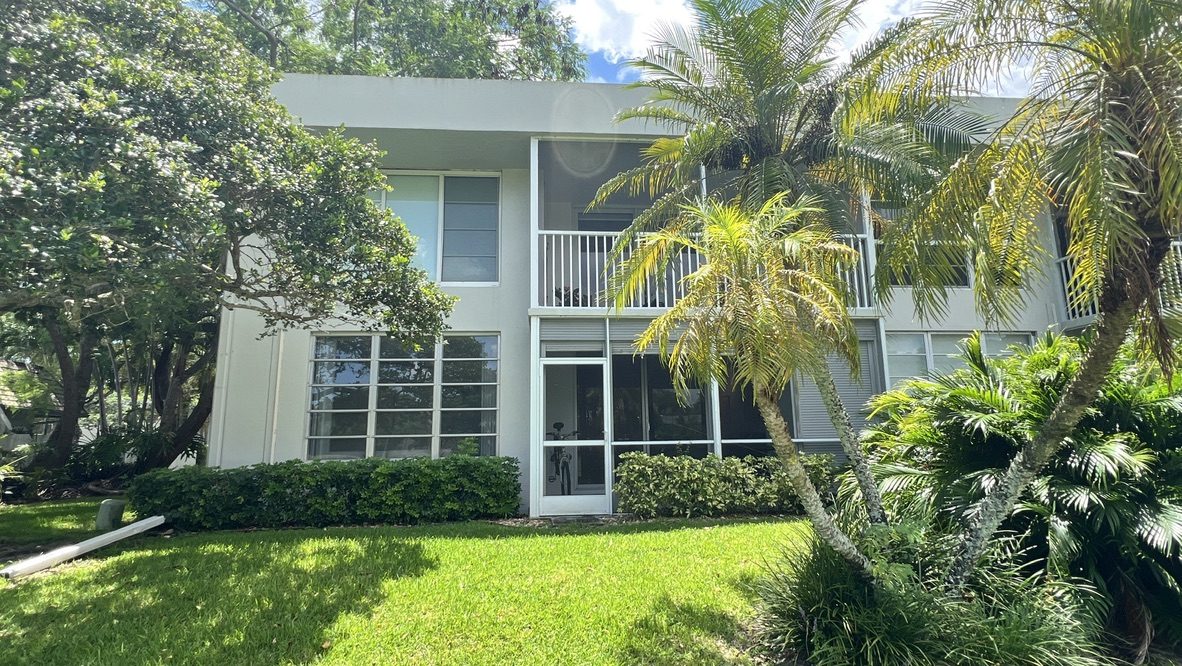 Building exterior with palm trees