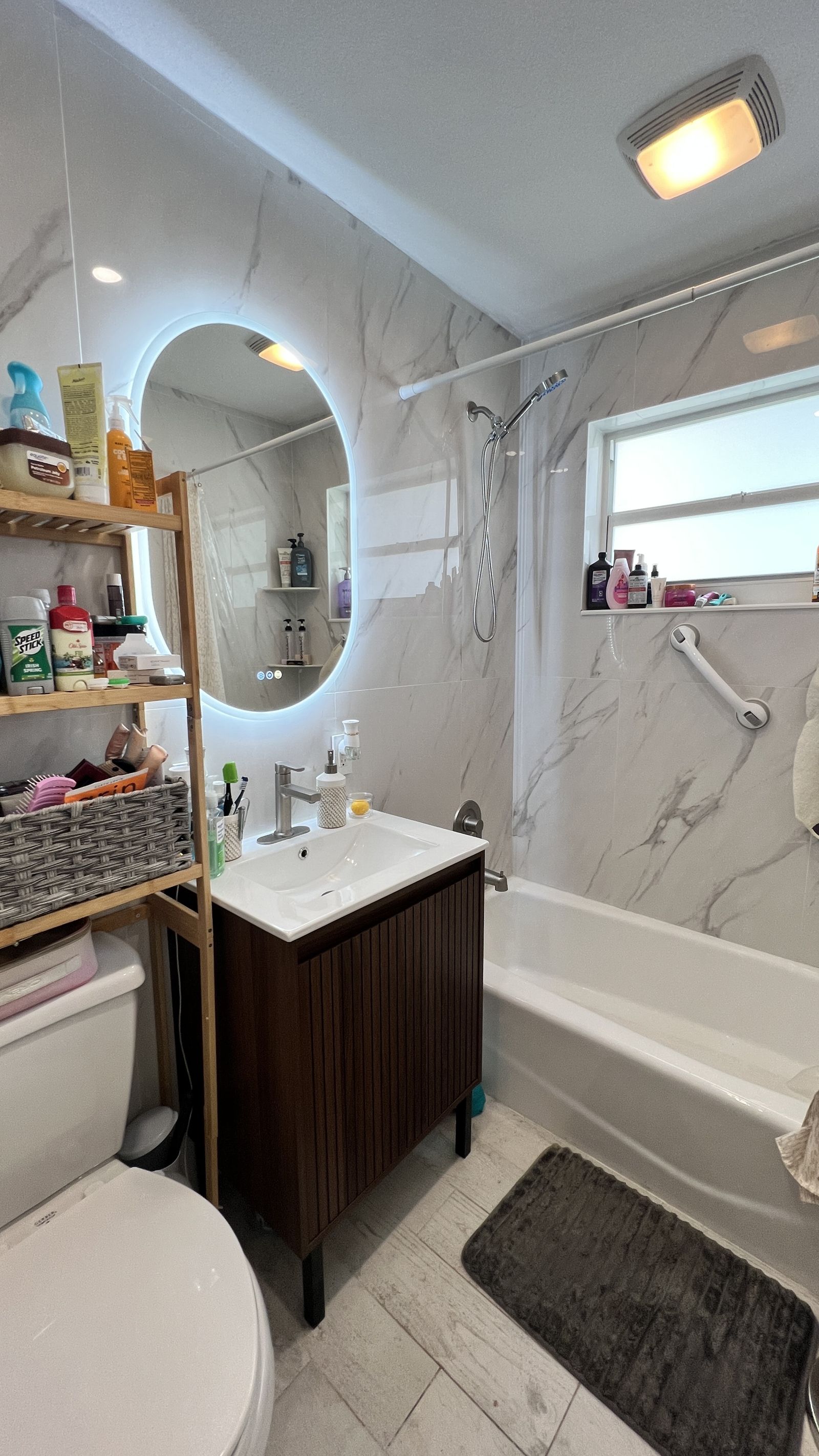Bathroom with marble tile and tub