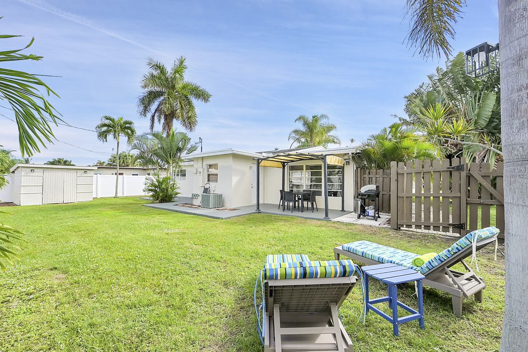 Backyard patio with pergola and grill