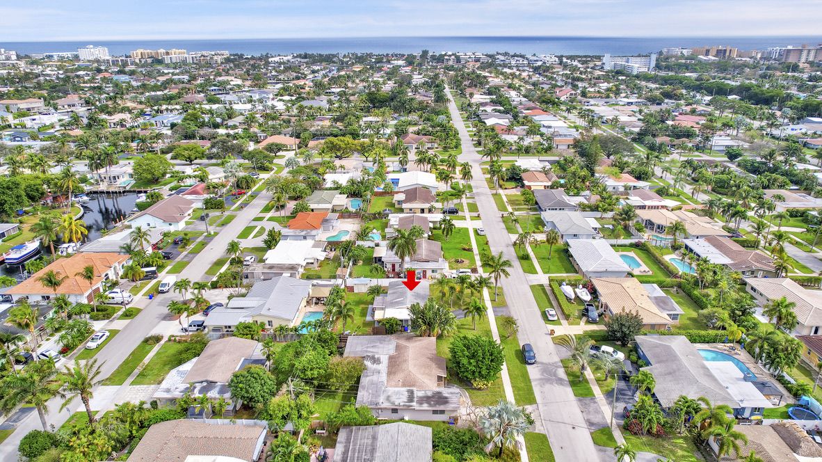 Aerial view of the property and neighborhood