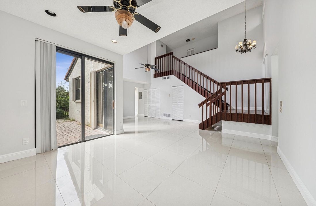 Empty living room with marble floor and staircase