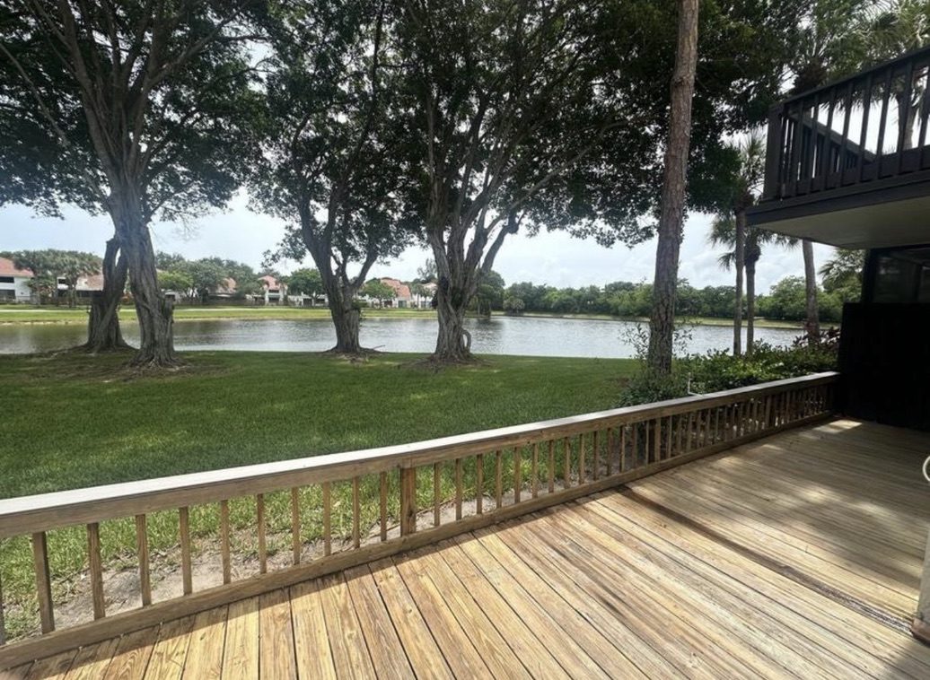 Deck with lake and golf course view