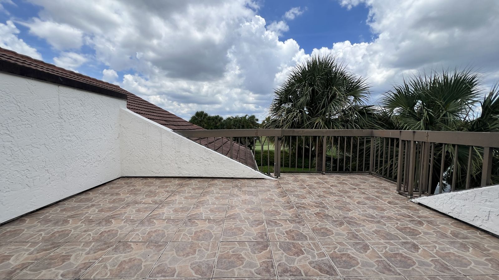 Upper rooftop terrace with golf course view